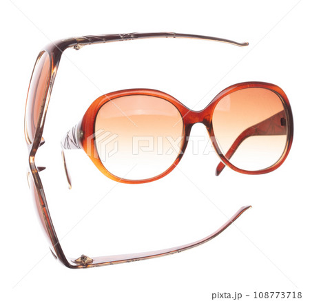 Brown lady sun Fashion Glasses fly in air showing many angle rotated. Fashion trend glasses for confident work and beautiful wearing is good for shape of head. White background isolated 108773718