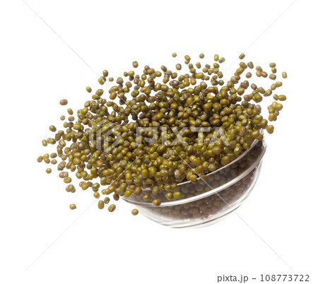 Green mung beans fly throw up in glass bowl, green mung bean float explode, abstract cloud fly. Dried green mung beans splash throwing in Air. White background Isolated high speed shutter, freeze 108773722