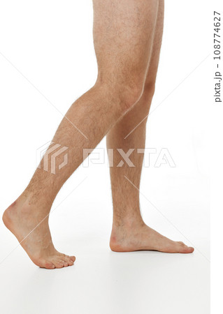 Barefoot male legs on white background. Body care concept. 108774627