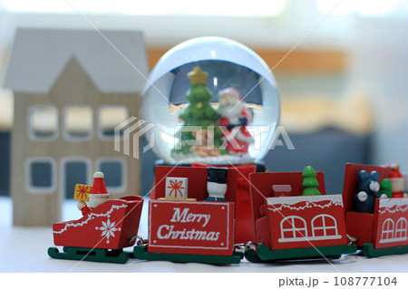 Snow Globe with Santa Claus. Christmas or New Year gift, Close up view, selective focus Snow Globe with Santa Claus. Christmas or New Year gift, Close up view, selective focus 108777104