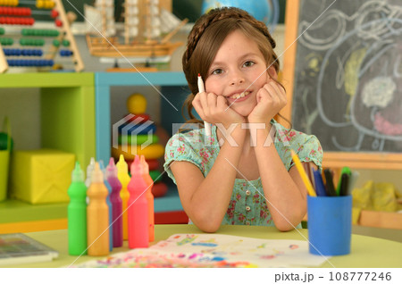 Portrait of cute girl drawing picture at home Portrait of cute girl drawing picture at home 108777246