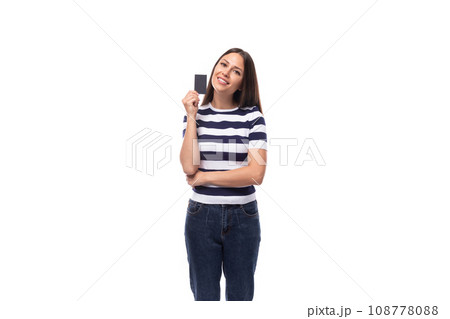 charming young european woman with black straight hair in a striped black and white t-shirt and charming young european woman with black straight hair in a striped black and white t-shirt and 108778088