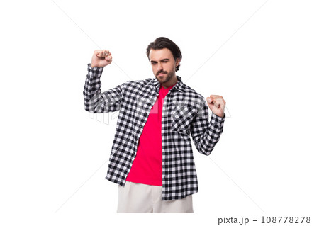 young caucasian handsome guy with a beard and chic hair on a white background with copy space young caucasian handsome guy with a beard and chic hair on a white background with copy space 108778278