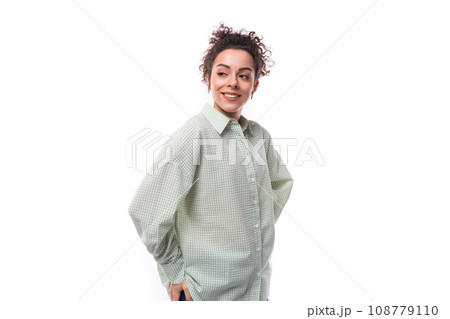 portrait of a young caucasian brunette dressed in a shirt looking into the distance portrait of a young caucasian brunette dressed in a shirt looking into the distance 108779110
