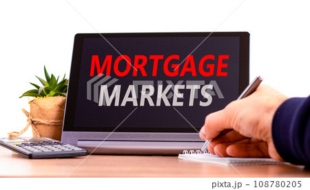 Mortgage markets symbol. Concept words Mortgage markets on beautiful black tablet. Beautiful white background. Calculator. Businessman hand. Business mortgage markets concept. Copy space. Mortgage markets symbol. Concept words Mortgage markets on beautiful black tablet. Beautiful white background. Calculator. Businessman hand. Business mortgage markets concept. Copy space. 108780205
