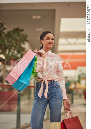 Happy Woman Walking with Shopping Bags in Shoping Mall Happy Woman Walking with Shopping Bags in Shoping Mall 108780874