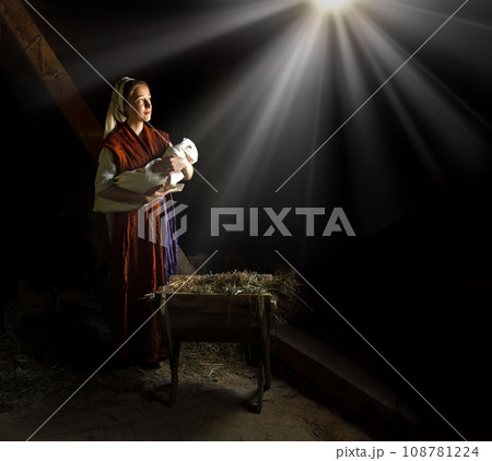 Mary in the stable near the manger with the baby Mary in the stable near the manger with the baby 108781224