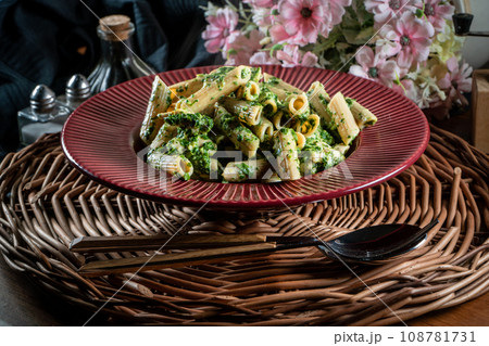 Penne pasta with spinach and chicken. 108781731