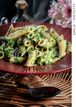 Penne pasta with spinach and chicken. Penne pasta with spinach and chicken. 108781733