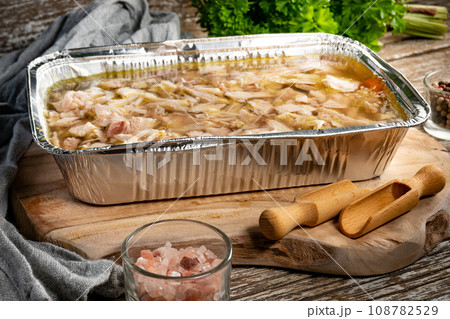 Jelly with shredded chicken meat in a mold. 108782529