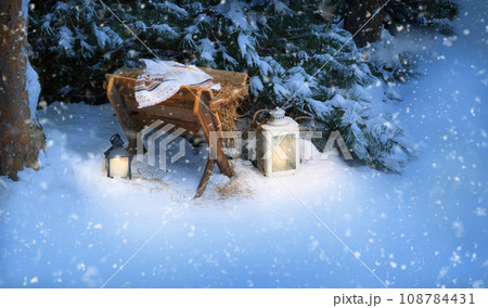 Manger with straw. Christmas background Manger with straw. Christmas background 108784431