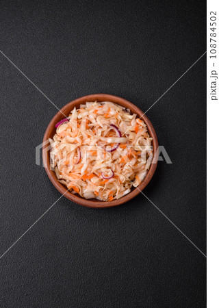 Delicious pickled salted cabbage with carrots, salt and spices Delicious pickled salted cabbage with carrots, salt and spices 108784502