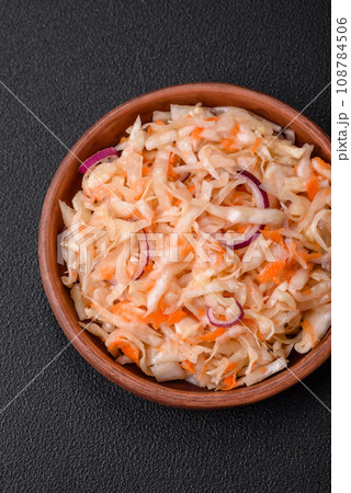 Delicious pickled salted cabbage with carrots, salt and spices Delicious pickled salted cabbage with carrots, salt and spices 108784506