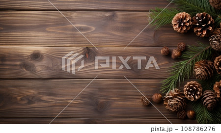 Christmas background with fir tree and decoration on dark wooden board Christmas background with fir tree and decoration on dark wooden board 108786276