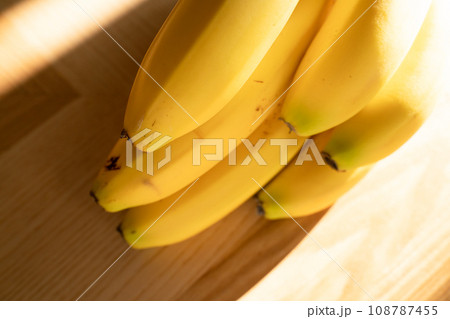 Ripe bananas bunch on the wooden background 108787455