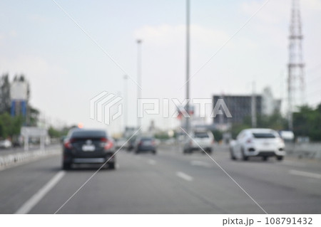 highway traffic with safety barrier on road asphalt, blurred image 108791432