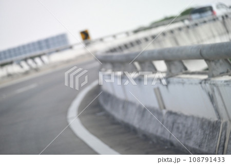 highway curve with safety barrier on road asphalt, blurred image highway curve with safety barrier on road asphalt, blurred image 108791433