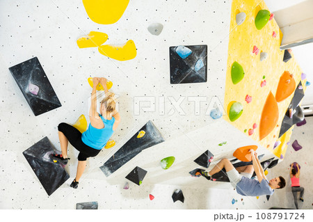 Climbing training on an artificial climbing wall indoor Climbing training on an artificial climbing wall indoor 108791724