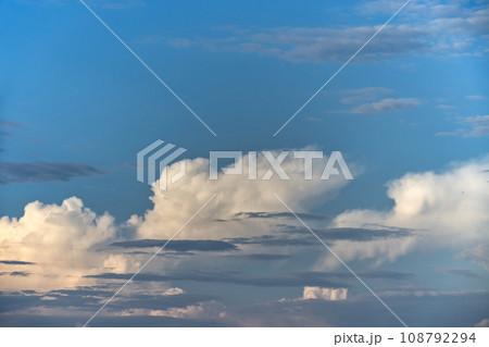 Cumulus clouds with a broad spectrum of blue shades 108792294