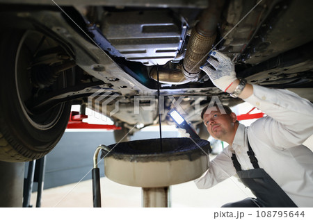 Male worker holding in hands electric torch 108795644