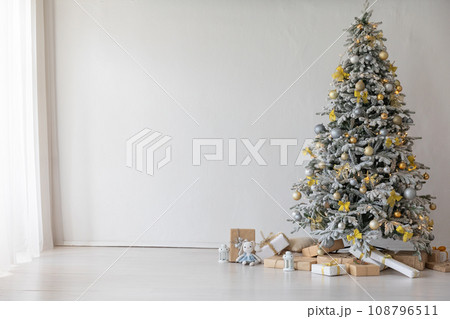 christmas tree with gifts and toys decorated with christmas garland 108796511