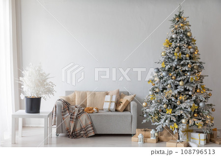 Christmas tree with gifts decorated with toys for new year 108796513