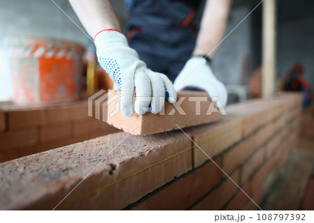 Man laying bricks 108797392