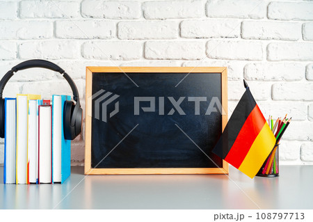 Blackboard and German flag on school desk 108797713