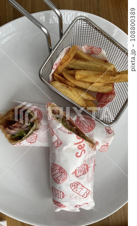 A portion of Sujuk Wrap Turkish food on the wooden table A portion of Sujuk Wrap Turkish food on the wooden table 108800389