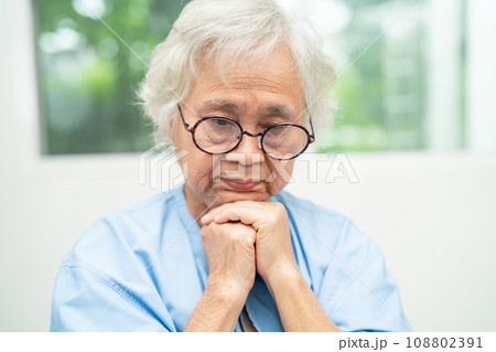 Asian senior woman wearing eyeglasses or vision glasses at home care service. 108802391