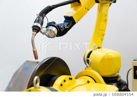 Automatic welding robot in a modern factory in operation 108804554
