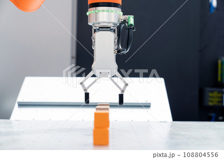 Modern handling robot - robotic arm. Smart factory Modern handling robot - robotic arm. Smart factory 108804556