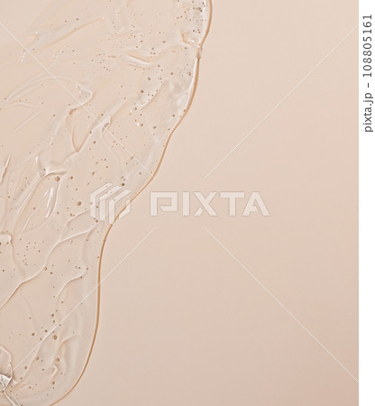 Abstract face serum texture. Skin care liquid gel on beige background. Transparent cosmetic face cream with bubbles for design. 108805161