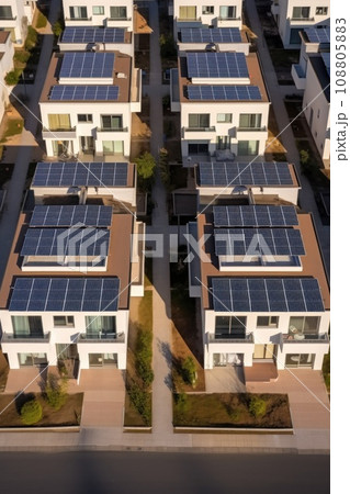 Eco-friendly apartment buildings with large solar panels on roofs surrounded by bright autumn trees 108805883