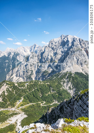 Vrsic Pass and Prisojnik, or Prisank, Mountain. Sunny day in Julian Alps, Slovenia 108806175