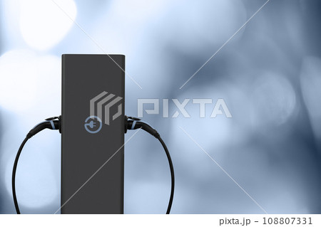 Electric car charging station on a gray background. Electric car charging station on a gray background. 108807331