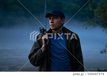 Man fishing on the mountain river at evening 108807374