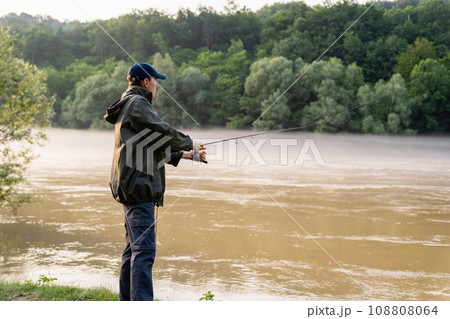 Man fishing on the river Man fishing on the river 108808064