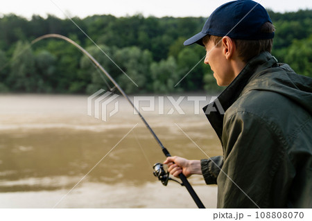 Man fishing on the river 108808070