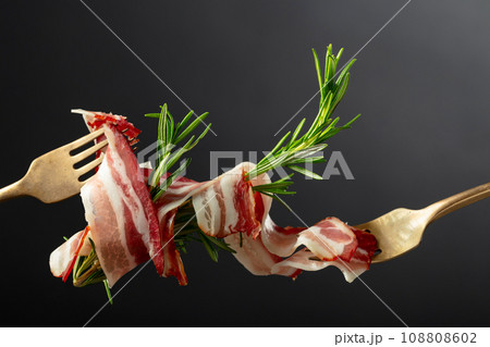 Dry-cured pork belly bacon with rosemary. Dry-cured pork belly bacon with rosemary. 108808602