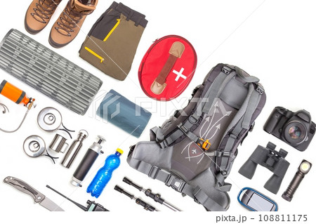 Set of tourist trekking items on white background. Top view of accessories for travel 108811175