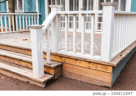 Backyard background photo with an empty wooden porch 108811947