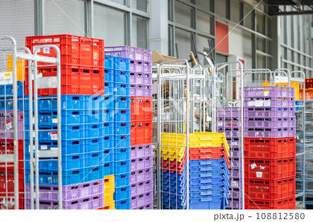 Plastic Crates Stacked behind food grocery retail store for supply chain products shipping distribution and business market consumption concept. 108812580