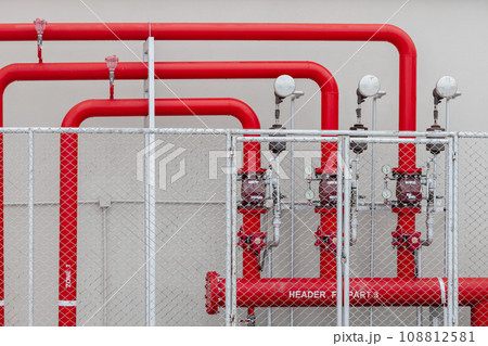 Sprinkler alarm high pressure water supply pipe line with control gauge valve in safety fence area industry building Sprinkler alarm high pressure water supply pipe line with control gauge valve in safety fence area industry building 108812581