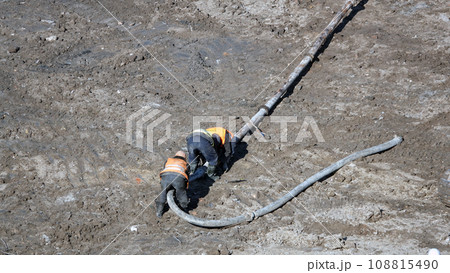 Kiev, Ukraine March 13, 2019: Workers - zero-cycle construction of the foundation of an entertainment center Kiev, Ukraine March 13, 2019: Workers - zero-cycle construction of the foundation of an entertainment center 108815490