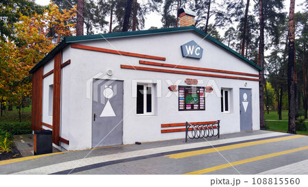 Kiev, Ukraine November 1, 2020: Arrangement of the park - Restroom in the park of Partisan Glory in Kiev - "Pole signpost where and what is in the park" Kiev, Ukraine November 1, 2020: Arrangement of the park - Restroom in the park of Partisan Glory in Kiev - "Pole signpost where and what is in the park" 108815560