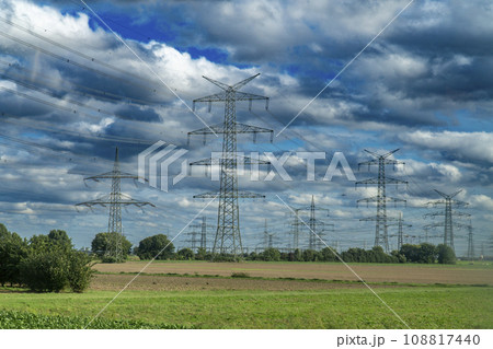 Electric Power Transmission Towers on a cloudy day 108817440
