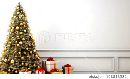 Christmas tree with presents under it in front of a white wall. 108818523
