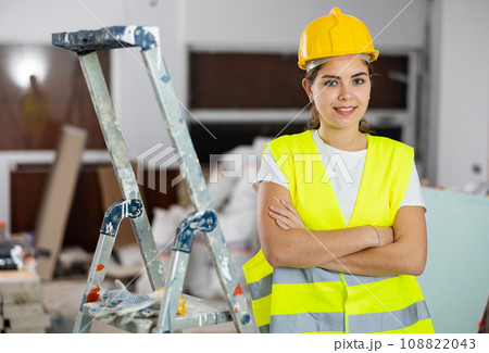 Portrait of young woman builder standing in apartment Portrait of young woman builder standing in apartment 108822043