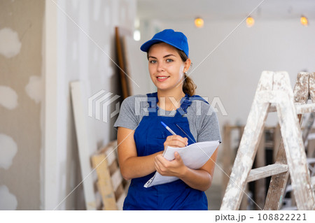 Woman construction worker with project documentation Woman construction worker with project documentation 108822221